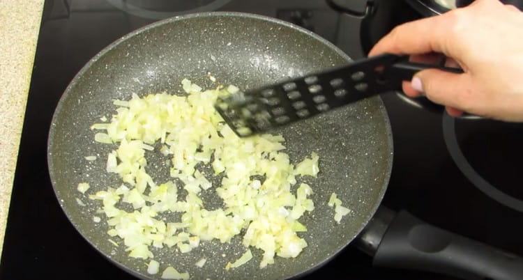 Fry the onions in a pan until transparent.