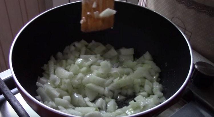 fry the onions in a pan with vegetable oil.