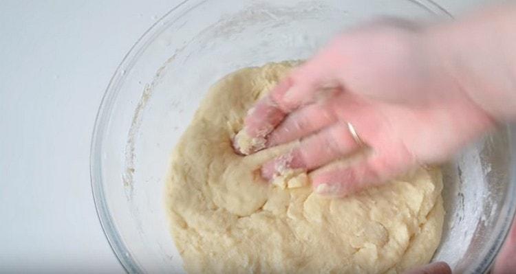 Next, knead the dough with your hands and leave it in a warm place.