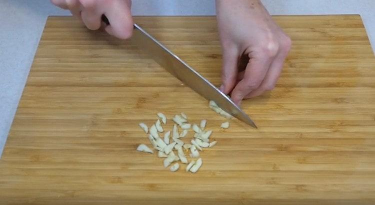 We also chop the garlic.