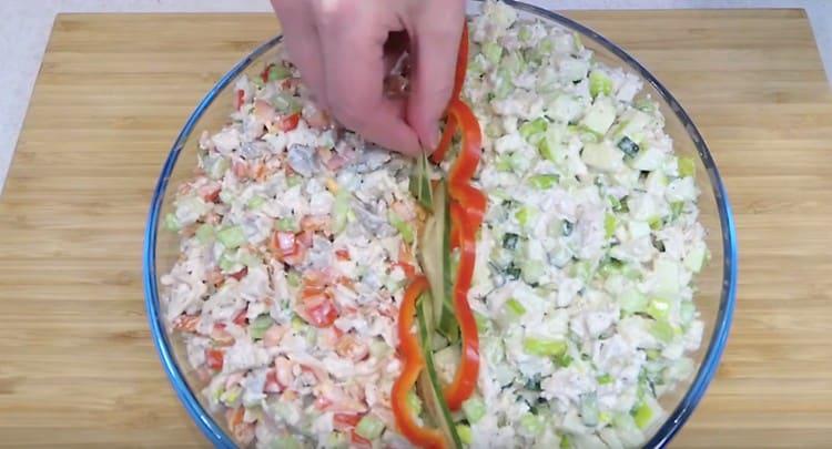 Decorate the dish with slices of pepper and cucumber.