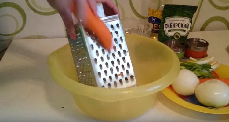 Three carrots on a coarse grater.