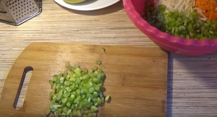 Cut celery stalks into pieces.