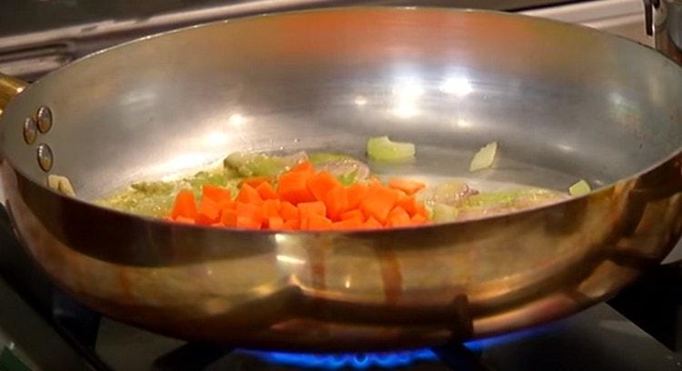 After a few minutes, add the carrots to the pan.