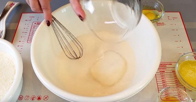 Add sugar and salt to milk with yeast.