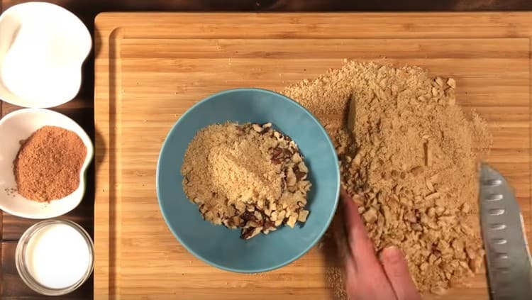Mix cookies with nuts in one bowl.