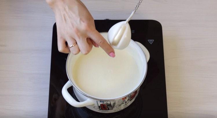 Cook the bechamel sauce until thickened.