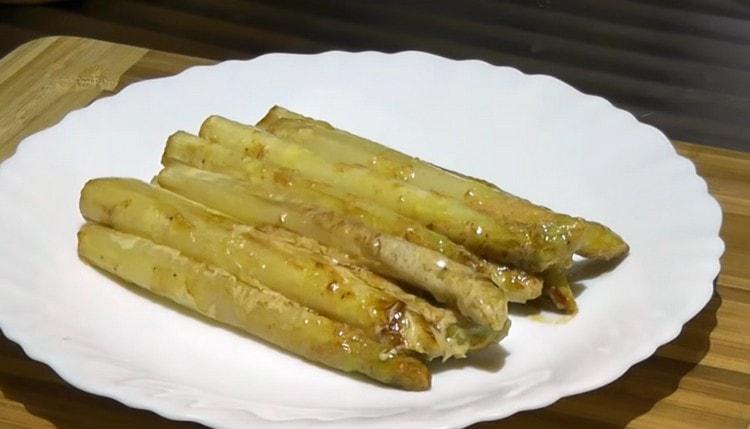 Put asparagus on a serving plate.