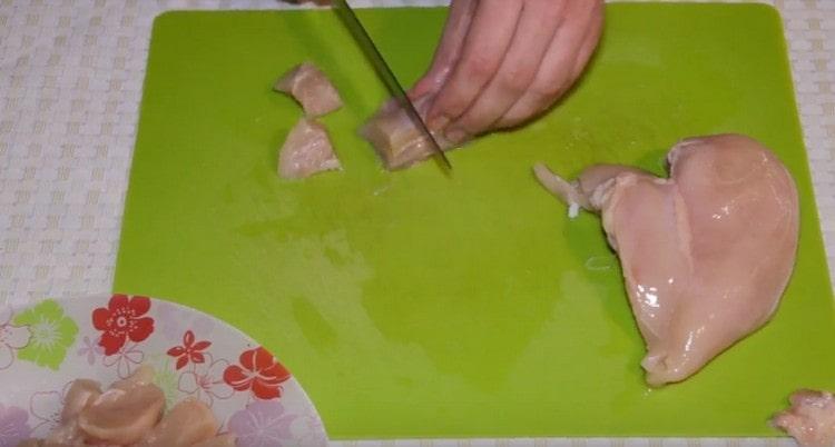 cut the chicken into pieces.