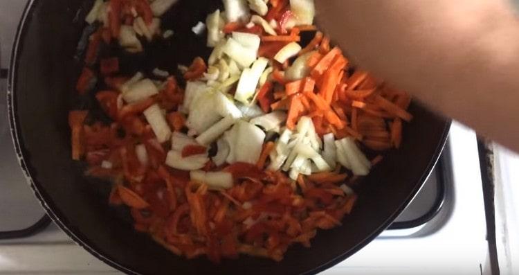 Fry chopped vegetables in a pan.