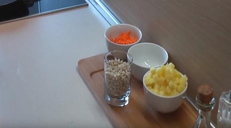 Cut potatoes, chop carrots, onions.