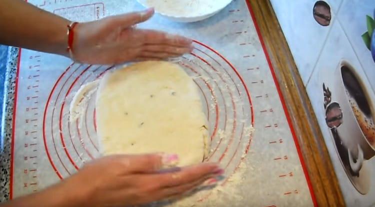 We form a thick layer from the dough with our hands.