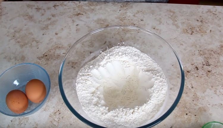 Sift the flour into a bowl, make a depression in it.