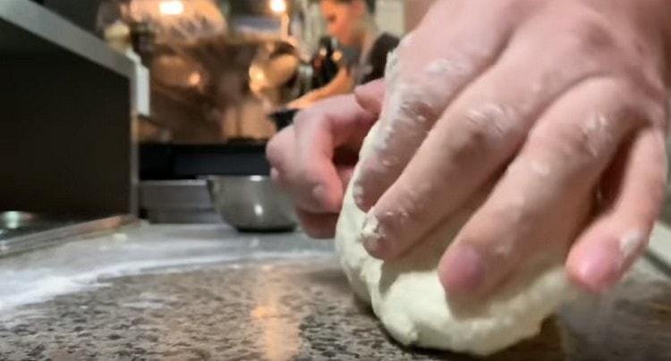 Then knead the dough on the work surface.
