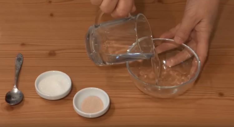 Pour warm water into a bowl.
