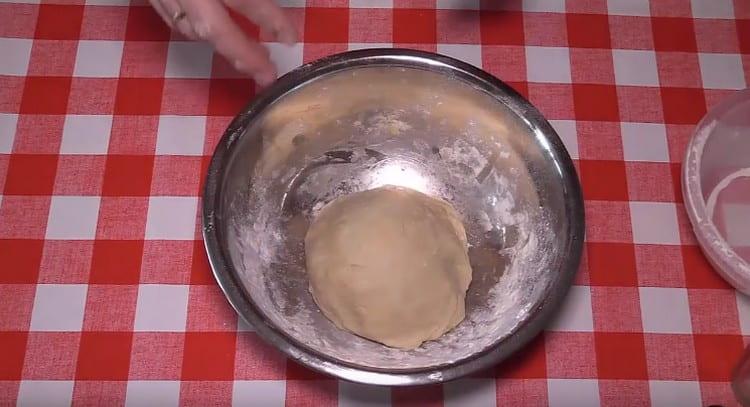 Leave the dough in a bowl in a warm place so that it can rise.