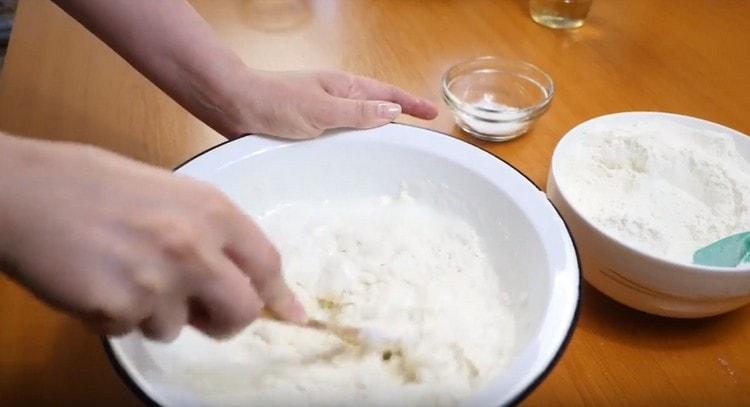 Gradually introduce flour to the liquid ingredients.