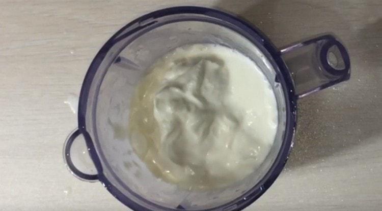 Pour sour cream into the blender bowl.