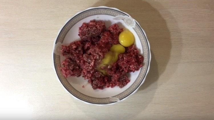 We beat out two eggs into the minced meat.