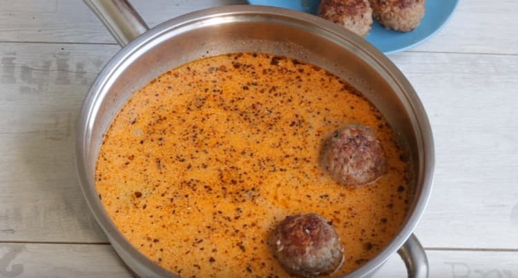 Put the meatballs in the sauce and simmer.