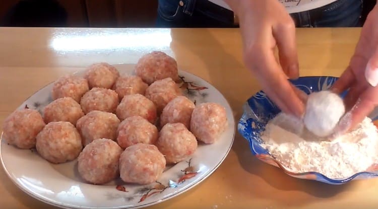 Roll each meatball in flour.