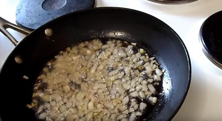 Fry chopped onions in a pan.