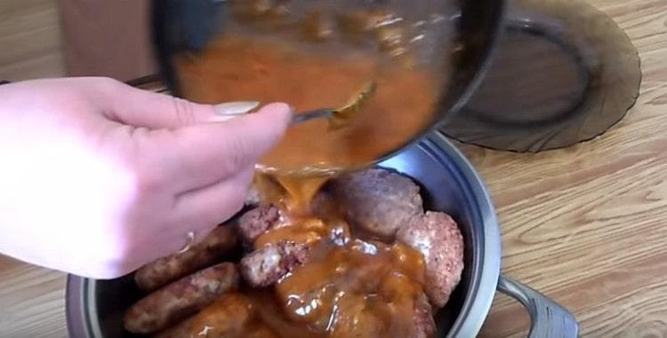 Dense gravy pour the meatballs arranged in a deep pan or stewpan.