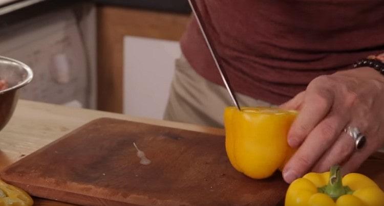 Cut the stem from the pepper and carefully remove the seeds.