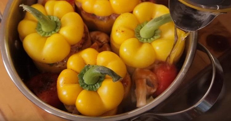 Pour hot water into a pan with peppers.