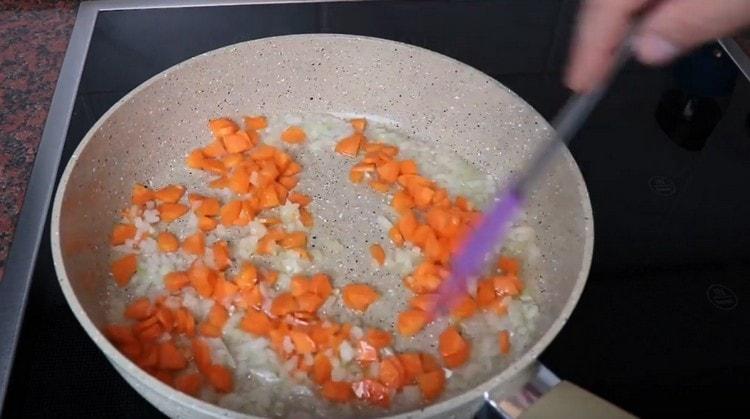 Add carrots to the onion.