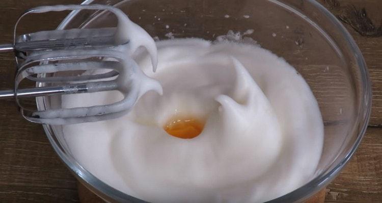 One at a time, add the yolk to the protein mass, whipping it each time.