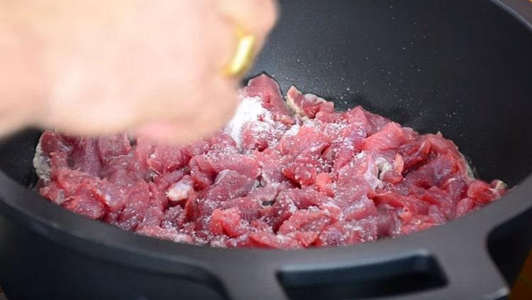 put the meat in a deep fry pan, salt.