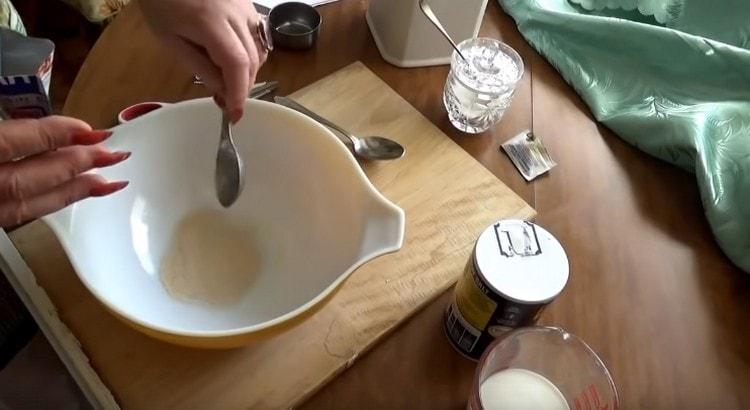 Pour yeast into a bowl.
