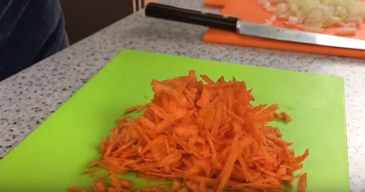 Grate carrots.