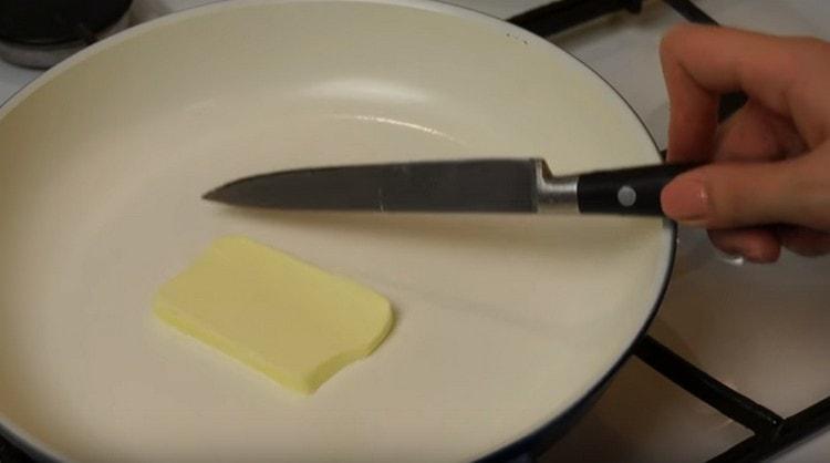 Melt a piece of butter in a pan.