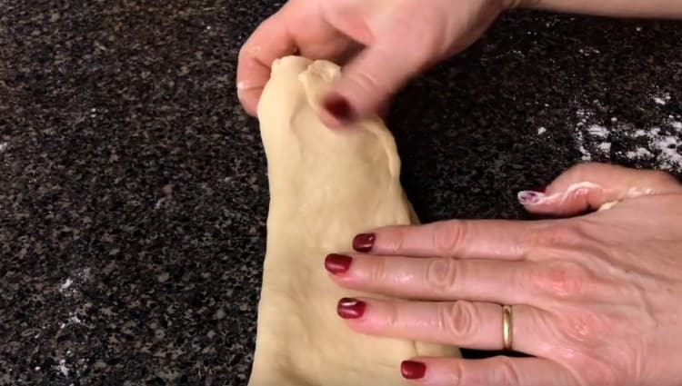 After removing the dough from the rolling pin, fold it.