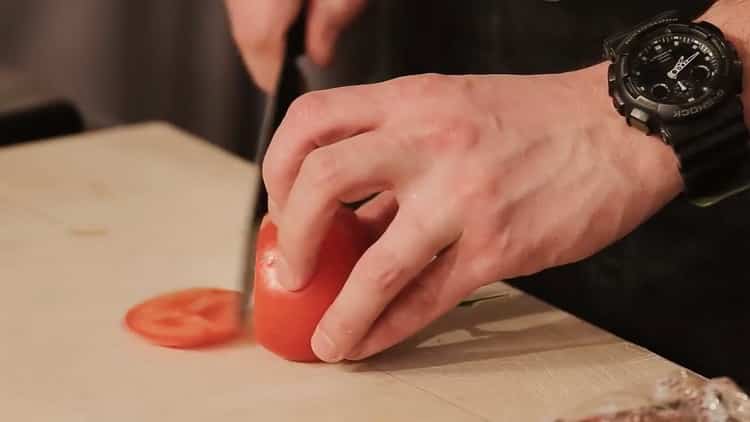 To make a burger, cut a tomato