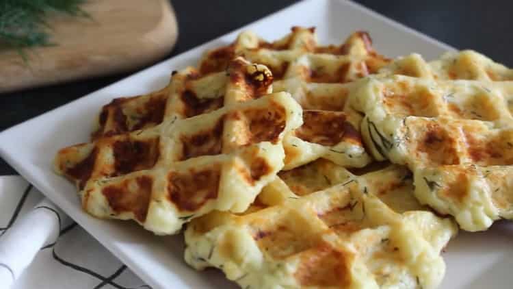 Cheese waffles in a waffle iron according to a step by step recipe with a photo
