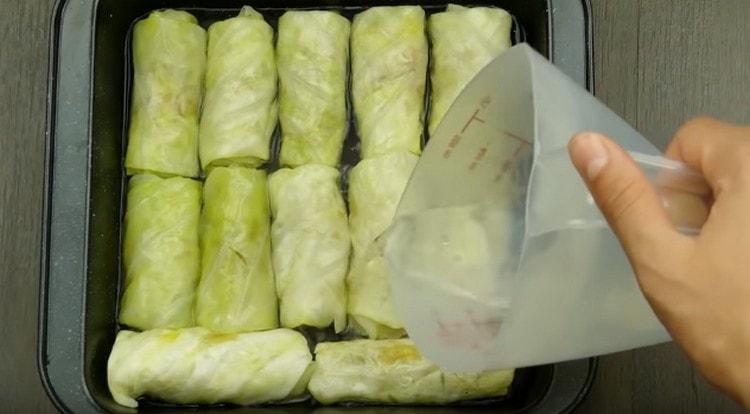 Fill cabbage rolls with boiling water, cover with foil and send to the oven.