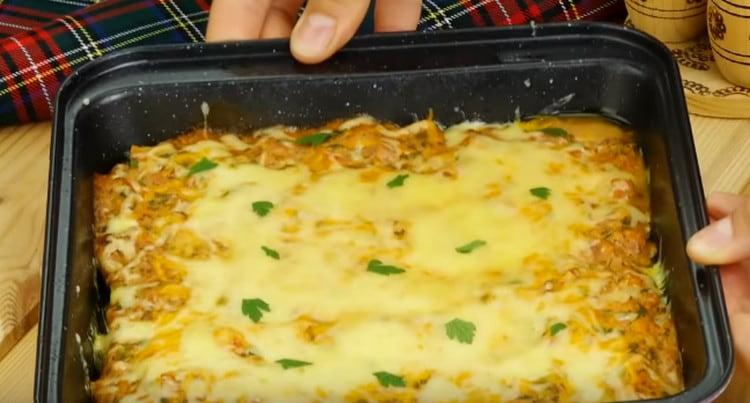 Stuffed cabbage in the oven in tomato and sour cream sauce is ready.