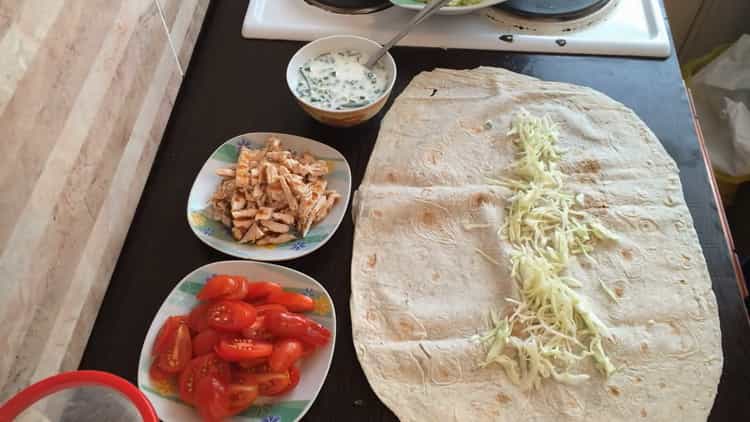 To cook the shawarma, put the cabbage on pita bread