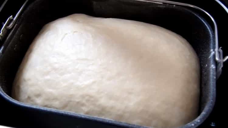 Yeast dough in a bread maker according to a step by step recipe with photo