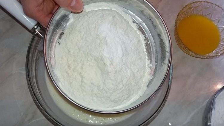 Sift half the flour with baking powder.