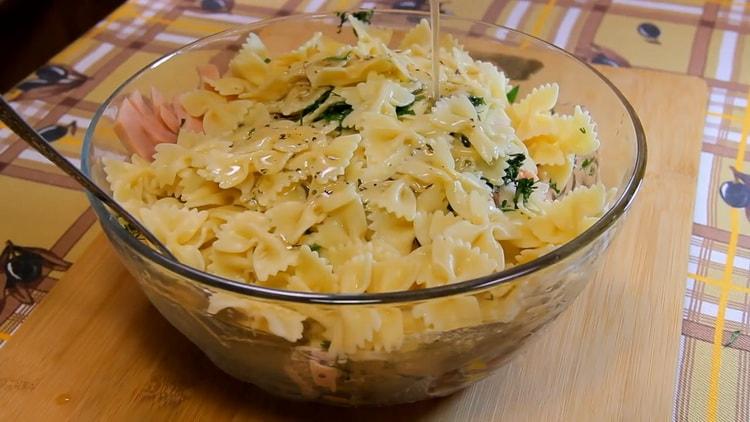 To make a pasta salad, add dressing to the salad