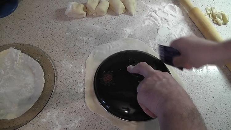 Roll out the dough to make pita bread