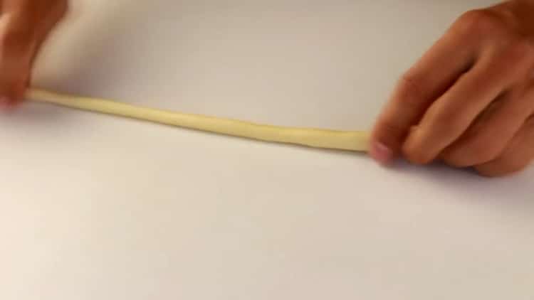 Stretch the dough to make lagman noodles