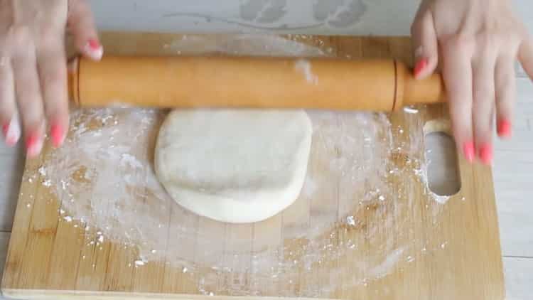 Roll out the dough to make udon noodles