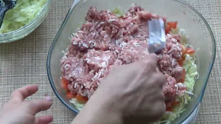 To prepare lazy cabbage rolls, lay a layer of minced meat