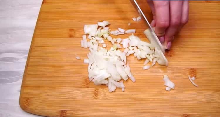 To make cabbage rolls, chop onion