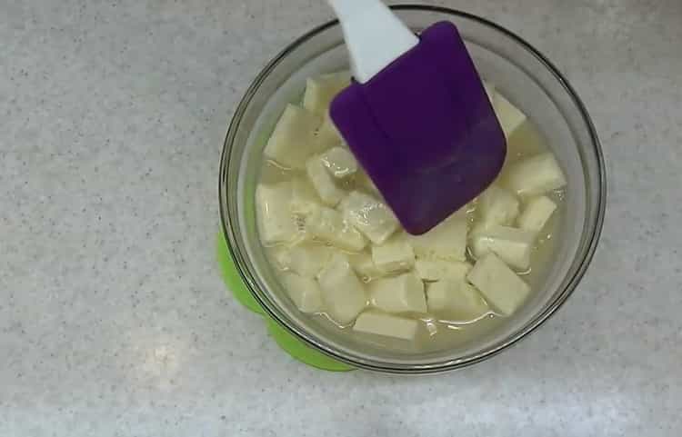 Melt the chocolate to make the cake.